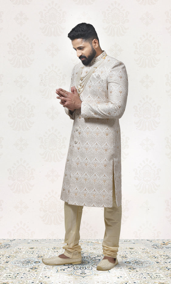 Antique Gold Sherwani with Intricate Embroidery, Jewel Buttons & Embellished Neckline
