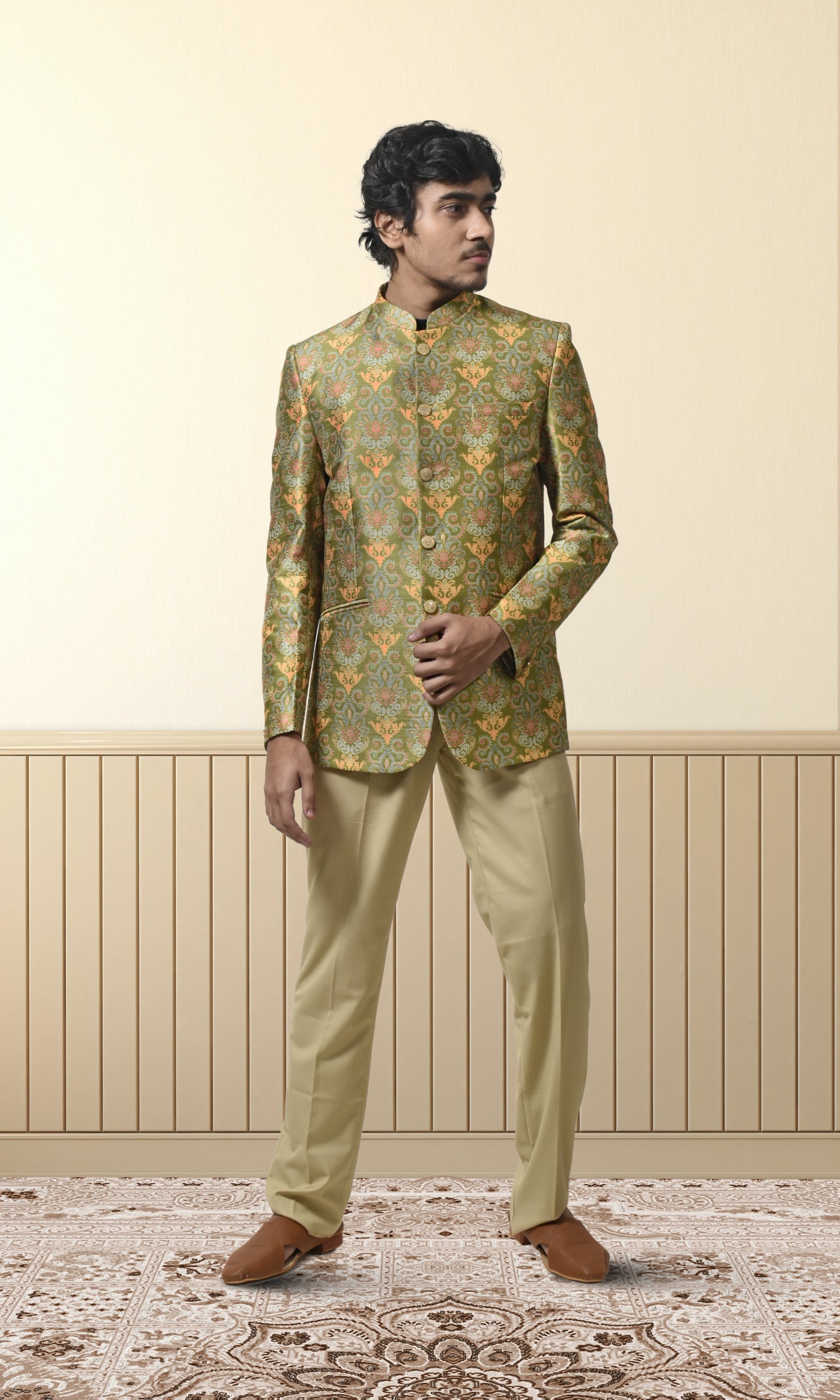 Regal green bandhgala with intricate floral and paisley motifs