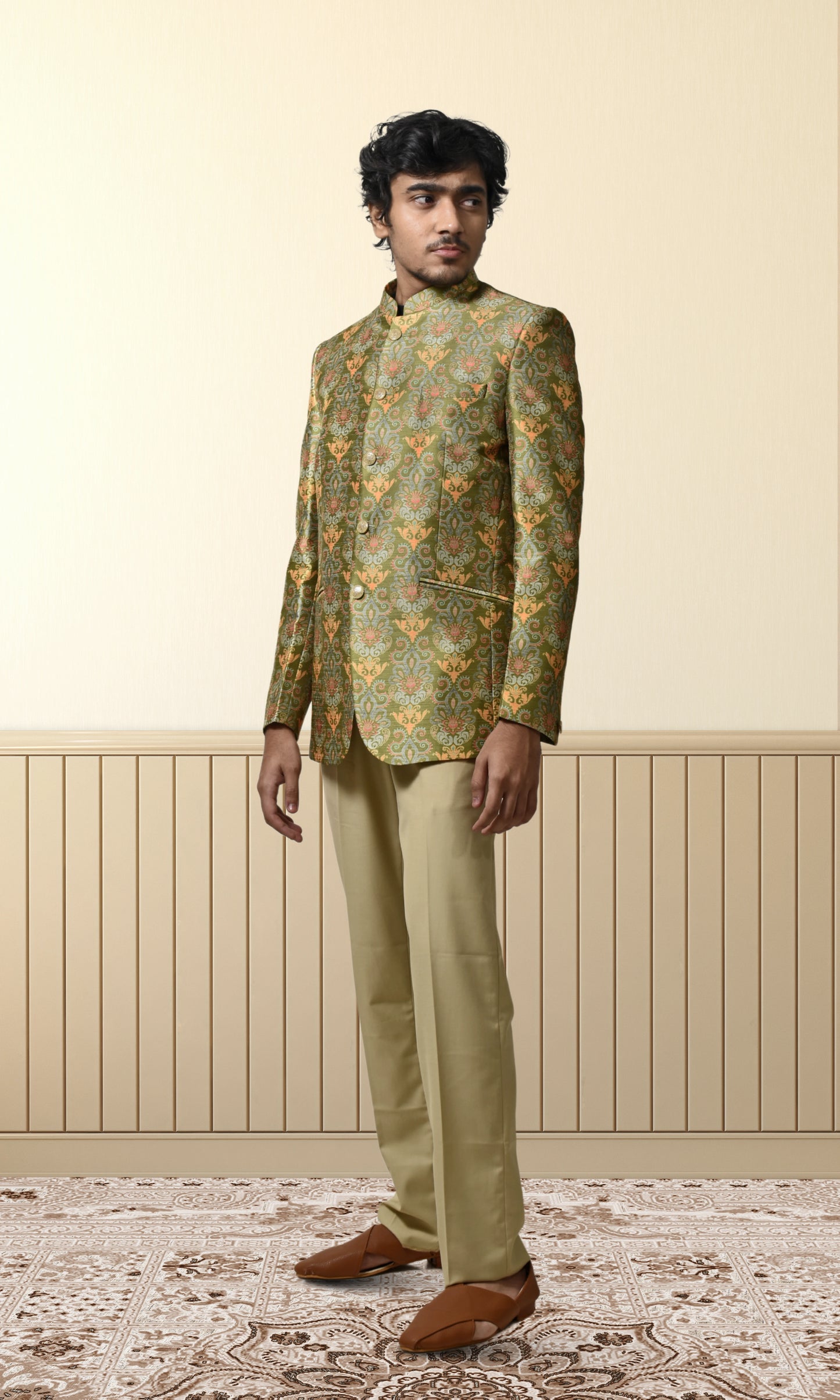 Regal green bandhgala with intricate floral and paisley motifs