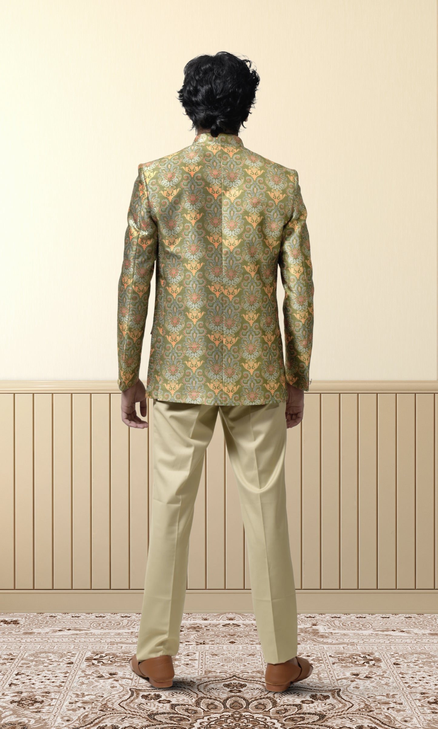 Regal green bandhgala with intricate floral and paisley motifs