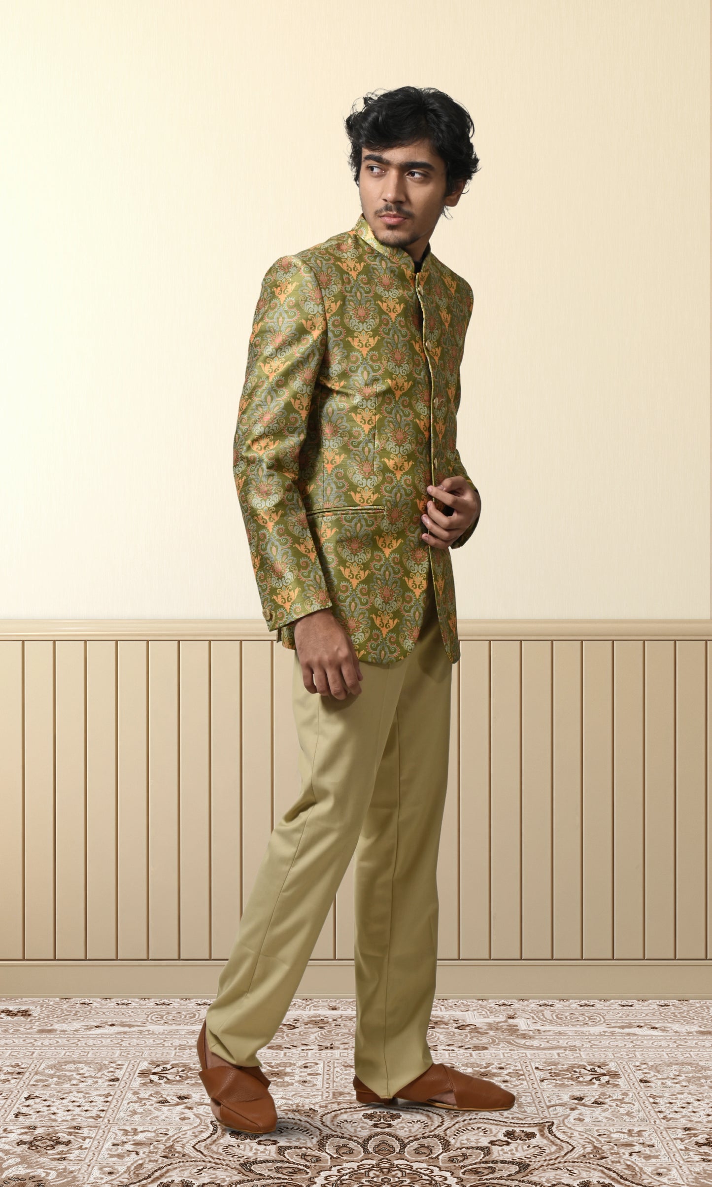 Regal green bandhgala with intricate floral and paisley motifs