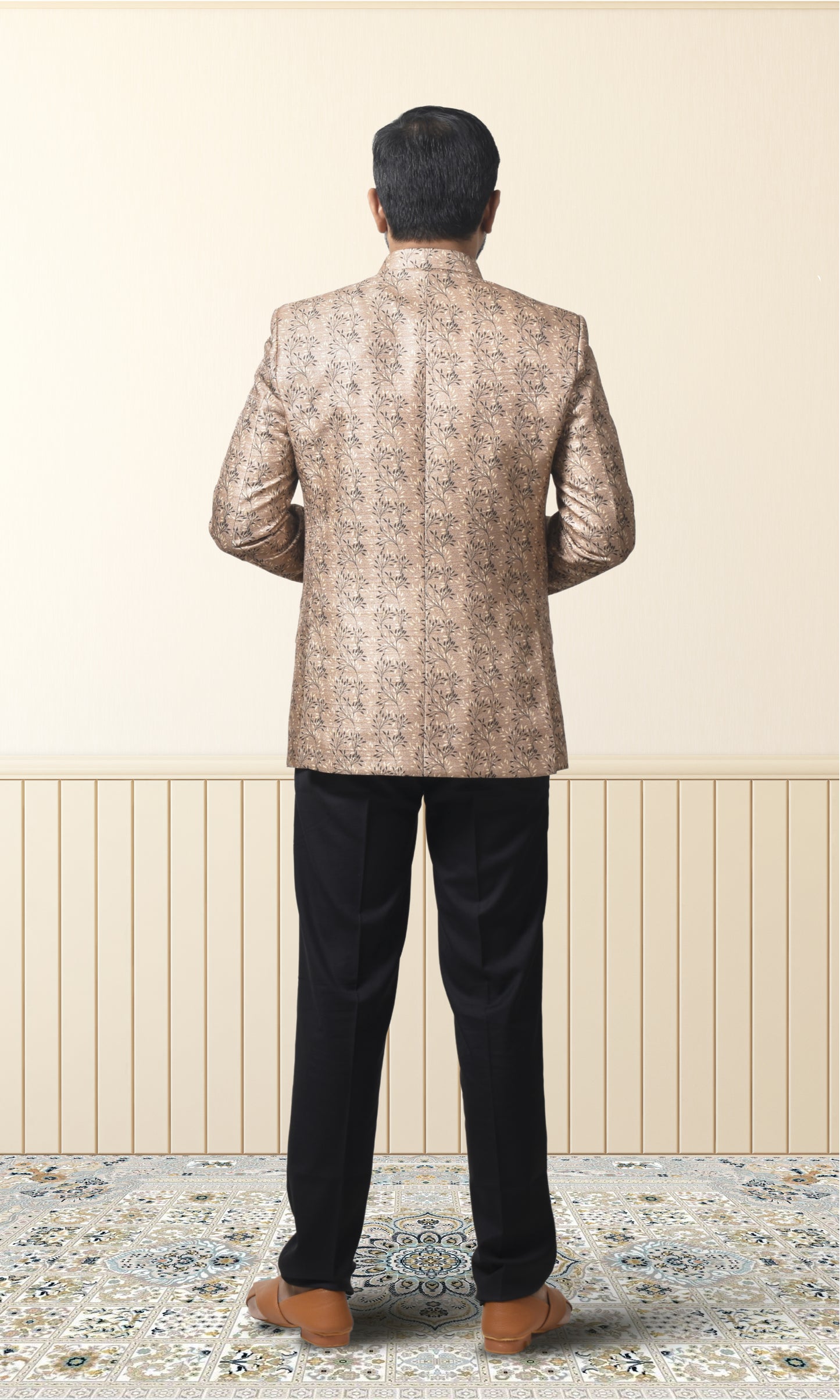 Regal beige bandhgala with intricate floral motifs and gold accents