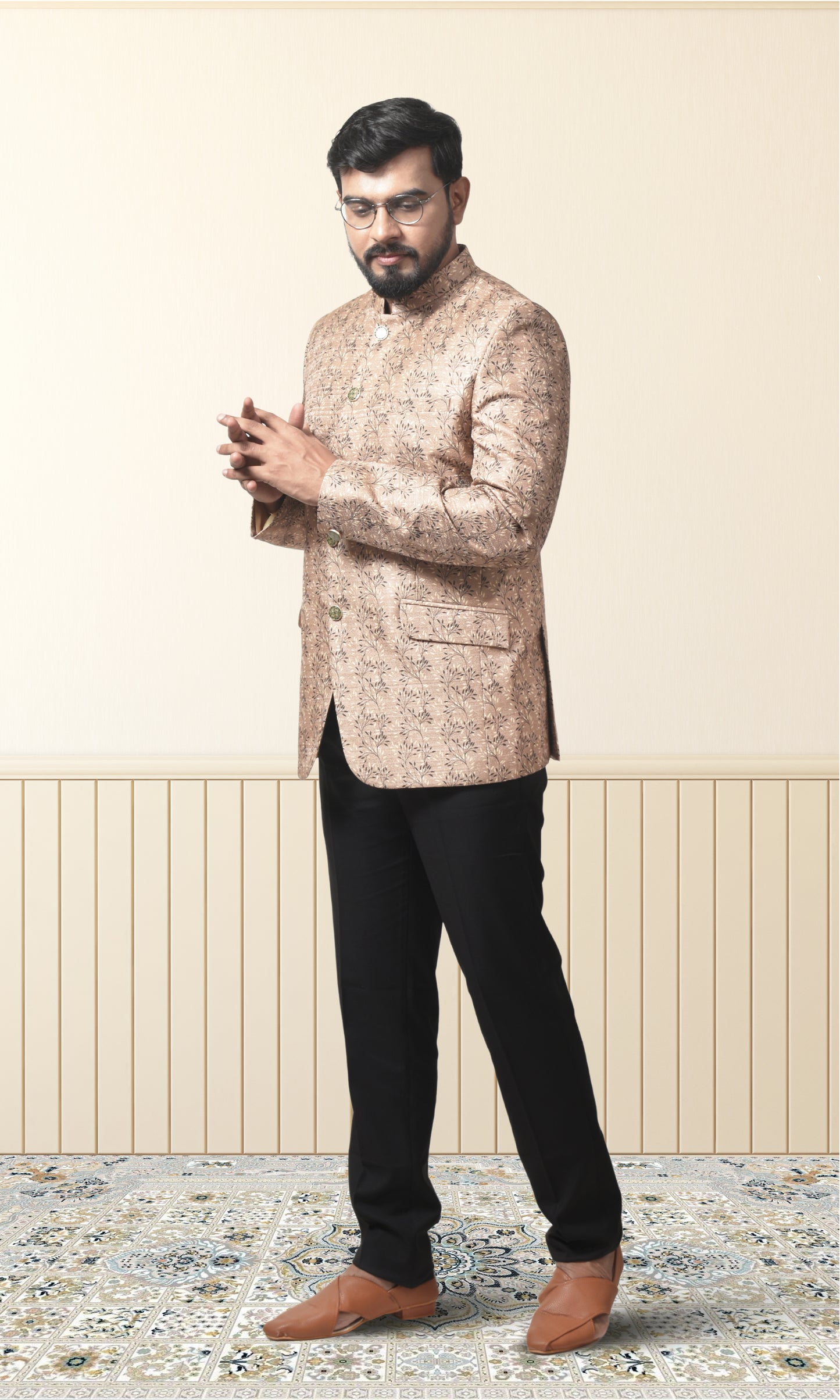 Regal beige bandhgala with intricate floral motifs and gold accents