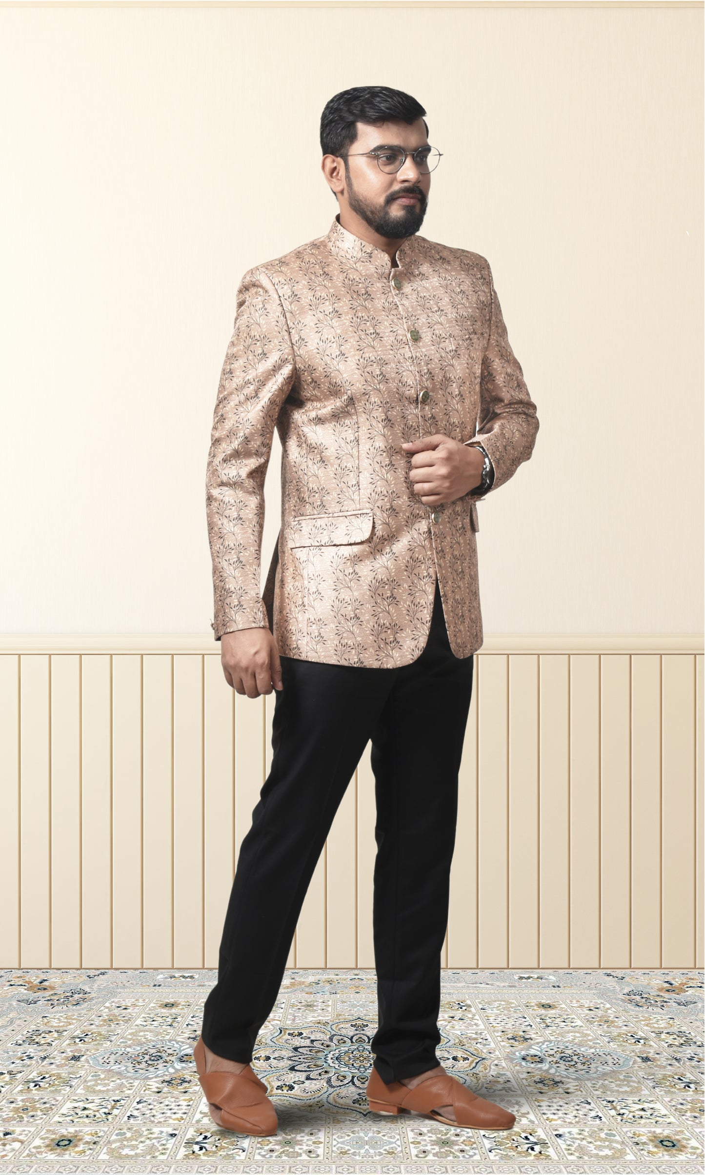 Regal beige bandhgala with intricate floral motifs and gold accents