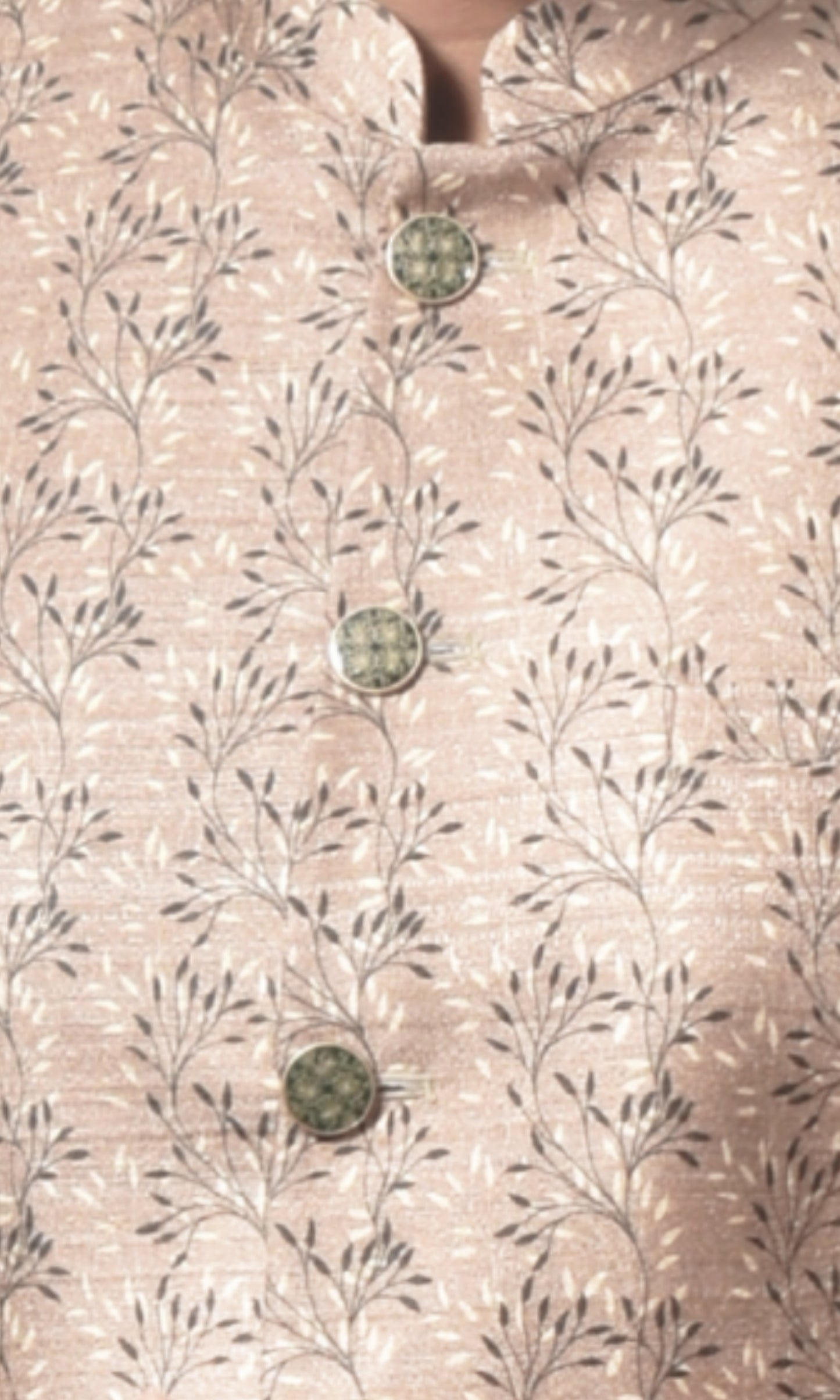 Regal beige bandhgala with intricate floral motifs and gold accents
